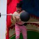 A man weightlifting at the circus