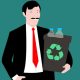 Picture of an office worker holding a recycling bin with plastic bottles