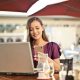 Picture of a business woman looking at her phone to check out daily quotes