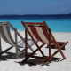 Picture of empty deckchairs on a bright sunny beach