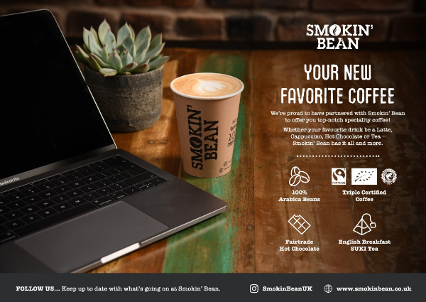 Image of a advert announcing partnership with brand Smokin Bean. Showing a laptop and a cup of coffee.