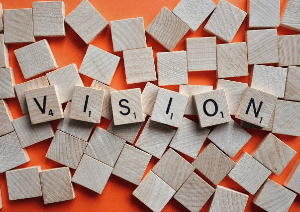 Image of wooden tiles spelling the word vision