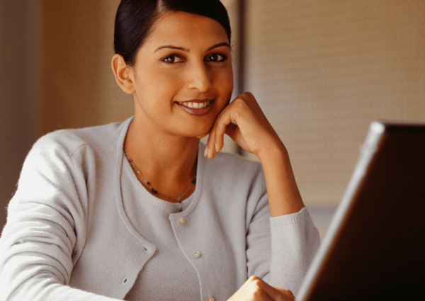 Image of a woman working on her laptop