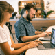 Pictures of two coworkers working from a hybrid location