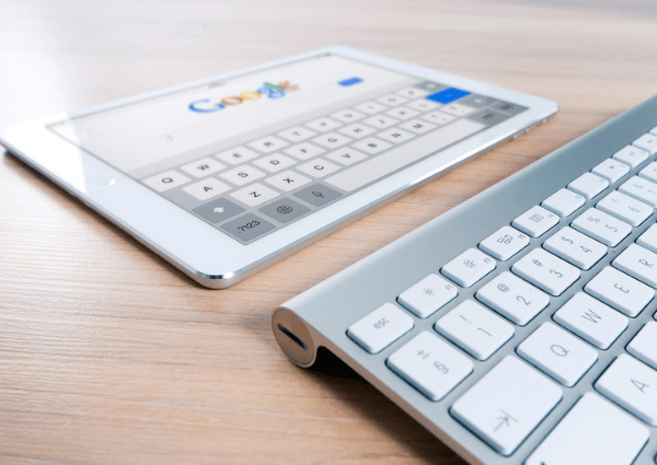 An image of a portable computer showing the google search engine