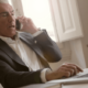 Image of a business owner communicating on his mobile phone