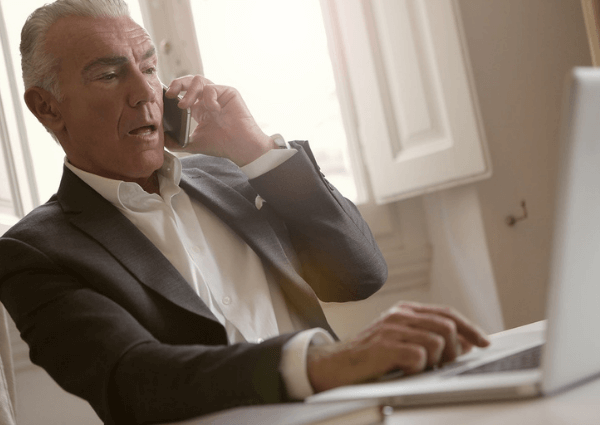 Image of a business owner communicating on his mobile phone