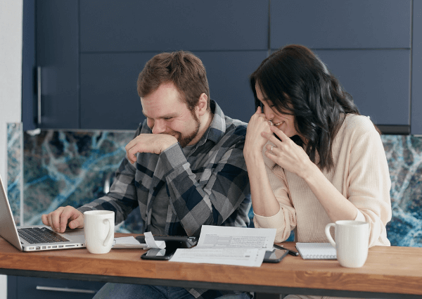 Picture of a man and a woman at work laughing