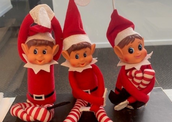 Picture of three elf's on a shelf