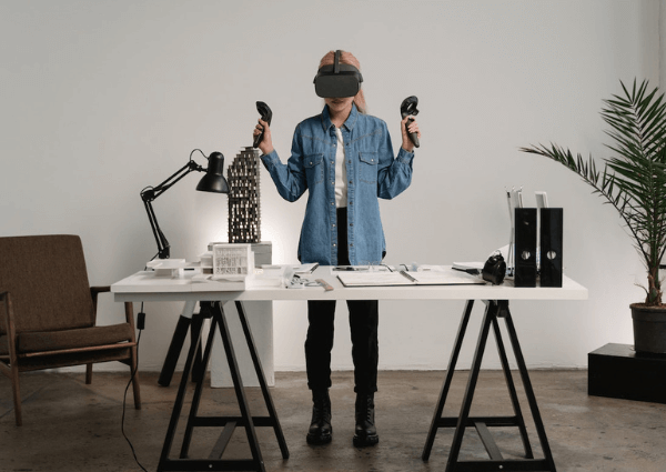 Photo of a woman in an office using virtual technology