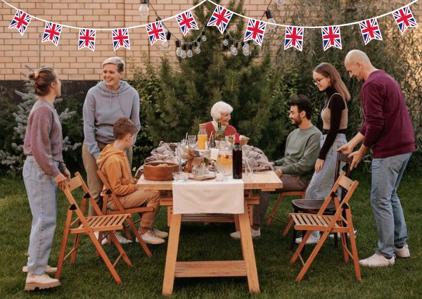 Image of a family eating in the garden and celebrating the bank holiday coronation