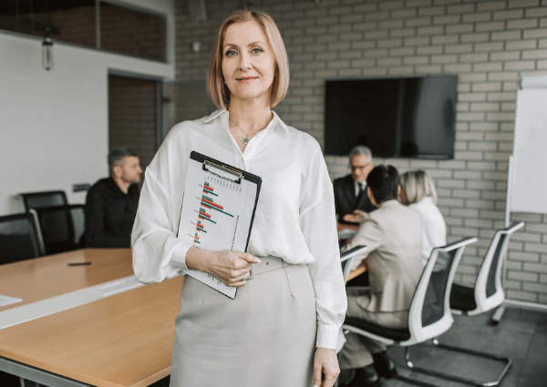 A business woman holding a presentation with client meetings in the background