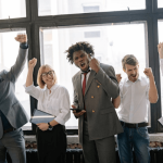 Image of a team in an office celebrating